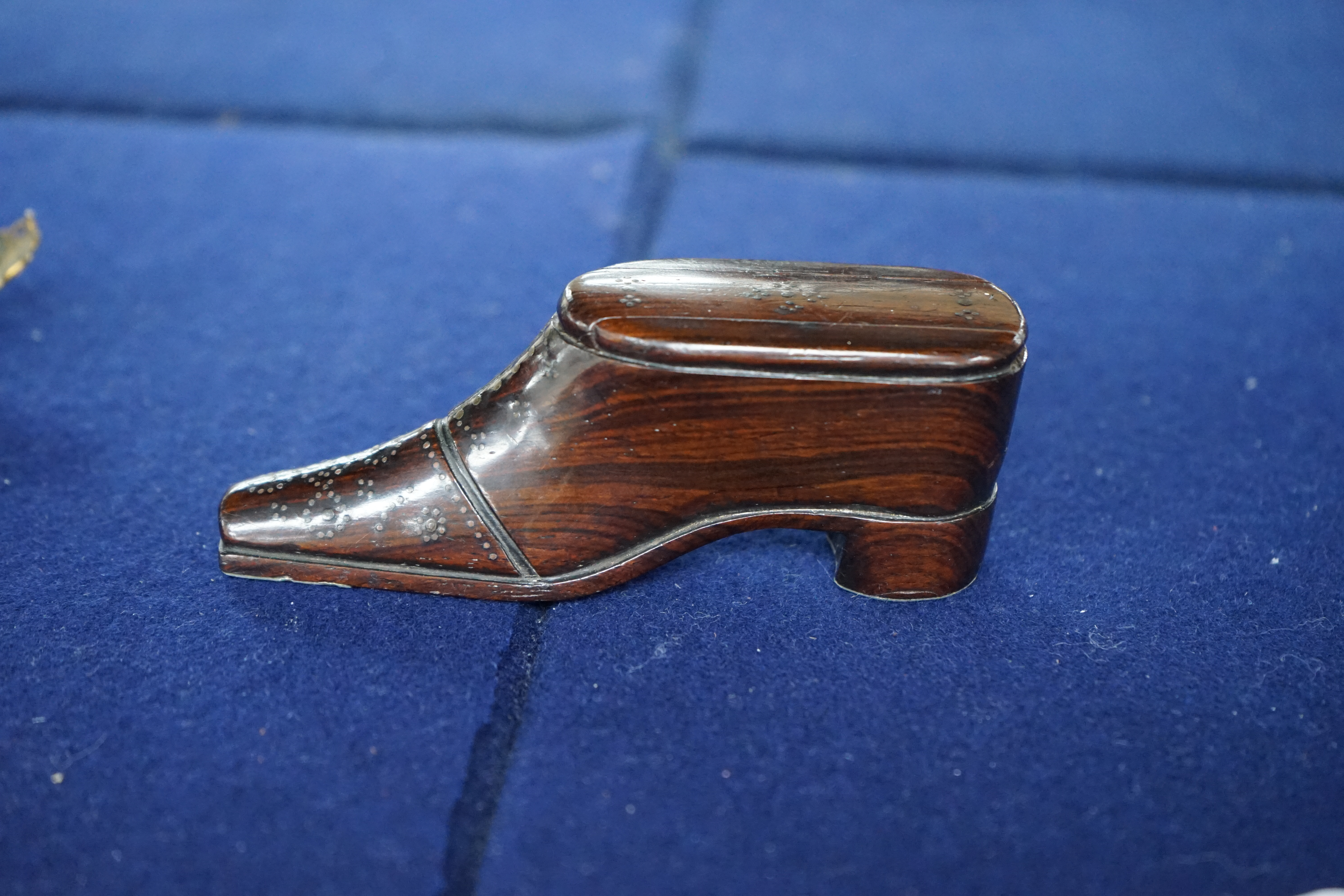 A 19th century rosewood and pique work snuff shoe, 11cm long. Condition - fair to good